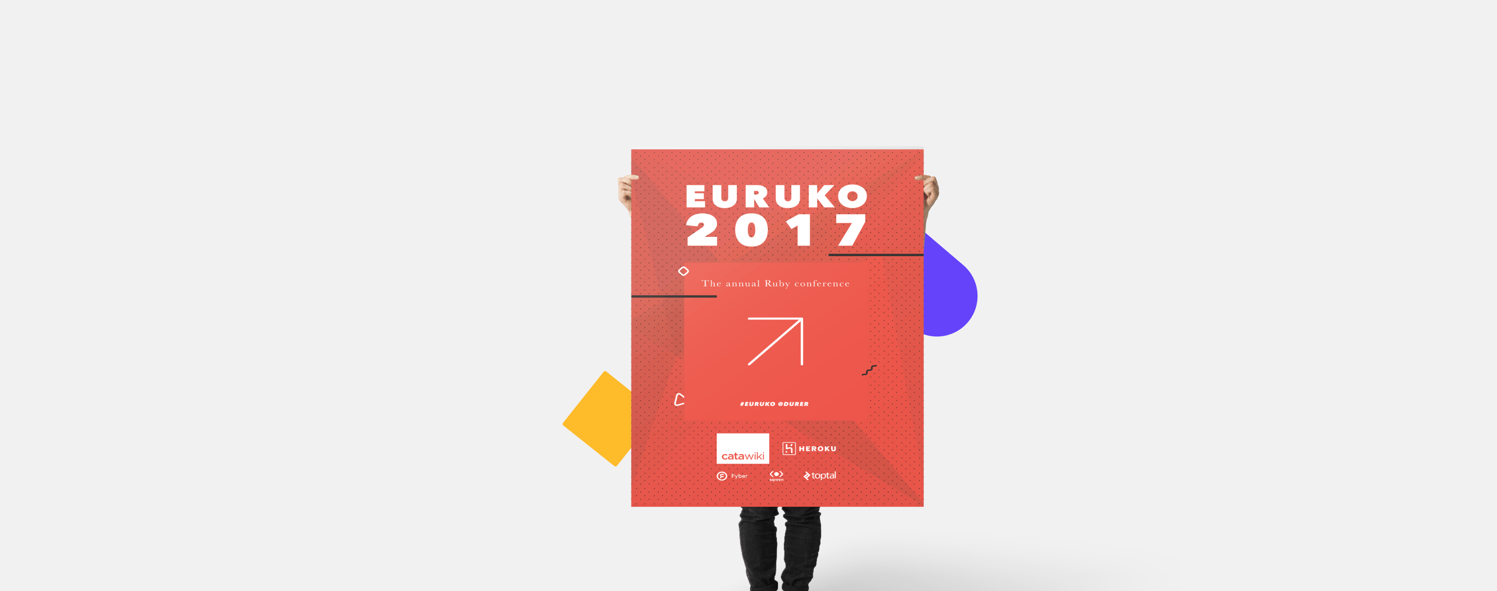 person holding an Euruko-2017 poster